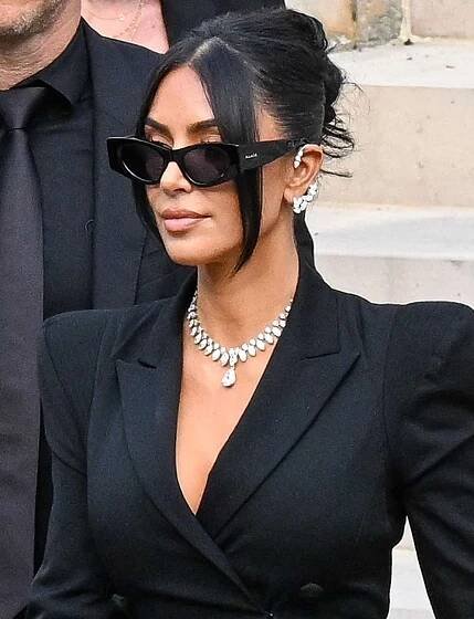 Kim Kardashian and Kris Jenner exit the trial at the Palais de Justice