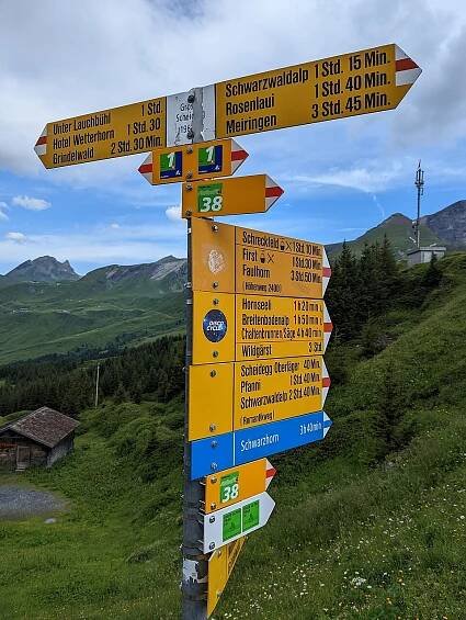 File:Swiss hiking trail sign post at Grosse Scheidegg.jpg