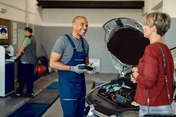 Mechanic talking to a client