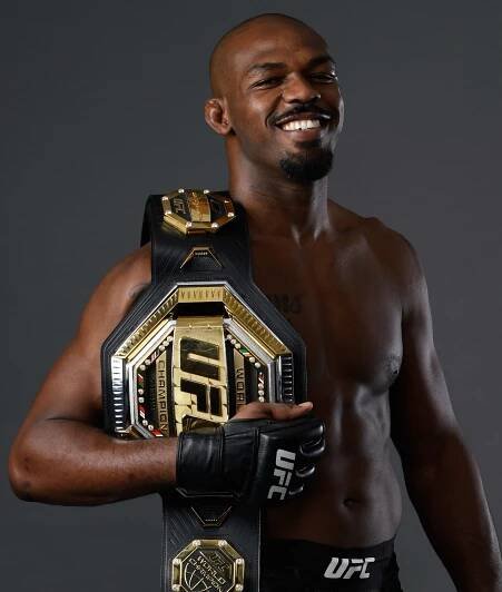 Jon Jones Smiling With Champ Belt Wallpaper