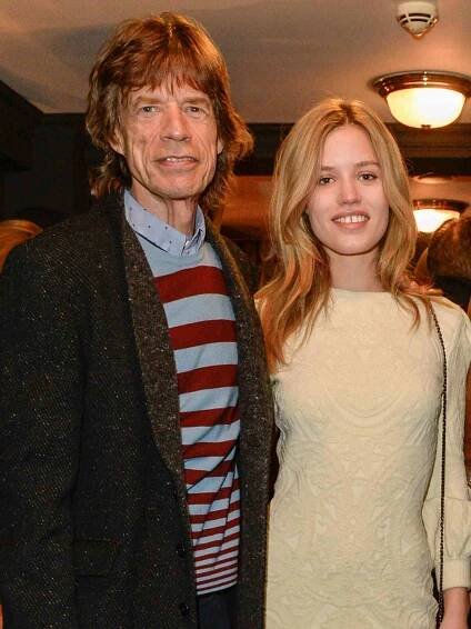 Mick Jagger and Georgia May Jagger at the press night performance of "Snow White And The Seven Dwarfs" on December 11, 2014 in Richmond, England.