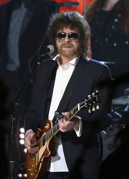 Jeff Lynne of ELO performing onstage with a guitar.