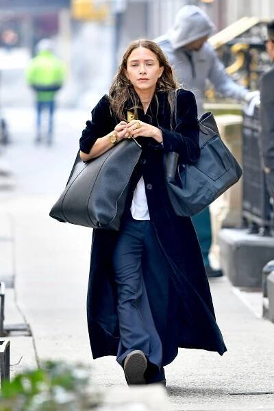 Image may contain Clothing Apparel Human Person Bag Handbag Accessories Accessory MaryKate Olsen and Coat