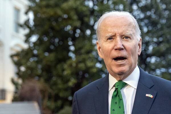 President Joe Biden speaks with reporters as he walks to Marine One upon departure from the South Lawn of the White House, Friday, March 17, 2023