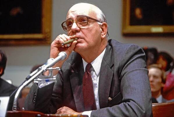 Volcker smoking cigar testifying