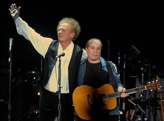 Paul Simon and Art Garfunkel on stage.