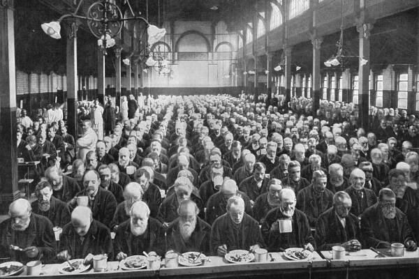 At dinner, St Marylebone Workhouse, London, circa 1901 (1903). From Living London, Vol. II, by George R. Sims. [Cassell and Company, Limited, London, Paris, New York & Melbourne, 1903].  Artist: Unknown. (Photo by The Print Collector/Getty Images)