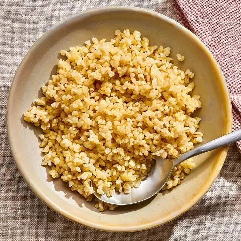 Overhead view of a brown serving bowl of The Only Basic Bulgur Recipe You'll Ever Need