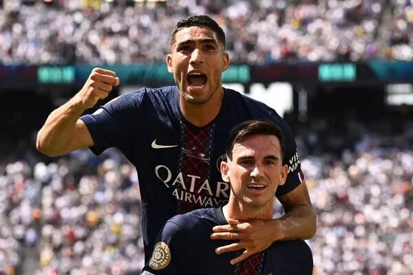 Fabian Ruiz of Paris Saint Germain celebrates his goal with Achraf Hakimi of Paris Saint Germain during the FIFA Club World Cup 2025 semi-final match between Paris Saint-Germain and Real Madrid CF 
