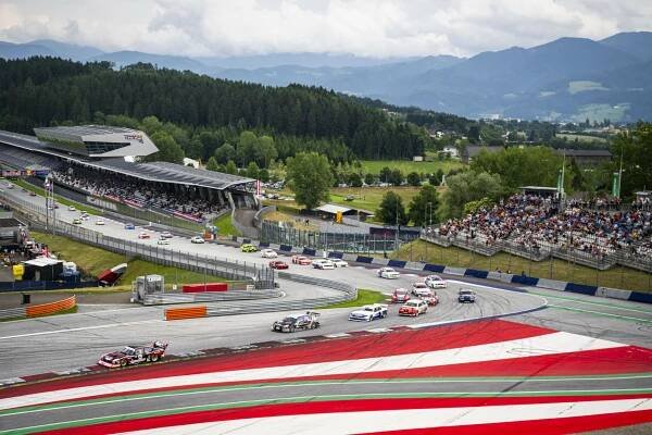 Cars of the Tourenwagen Golden Era driving through Turn 1