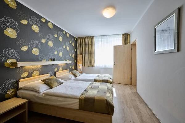 Postel nebo postele na pokoji v ubytování Hotel Akademie