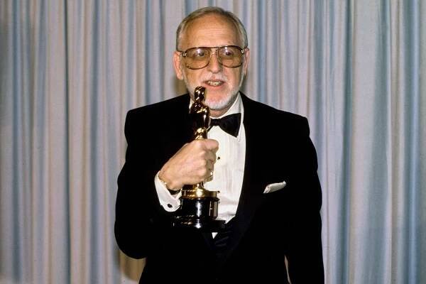 American screenwriter and film director Robert Benton in the press room of the 57th Academy Awards, held at the Dorothy Chandler Pavilion in Los Angeles, California, 25th March 1985. Benton holds his 'Best Screenplay Written Directly for the Screen' award, won for his script for 'Places in the Heart '.