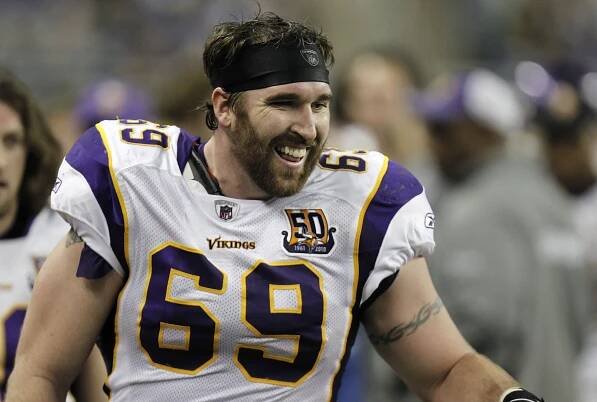 Jared Allen smiles on the bench after returning an interception for a touchdown while playing the Detroit Lions at Ford Field on January 2, 2011 in Detroit, Michigan.