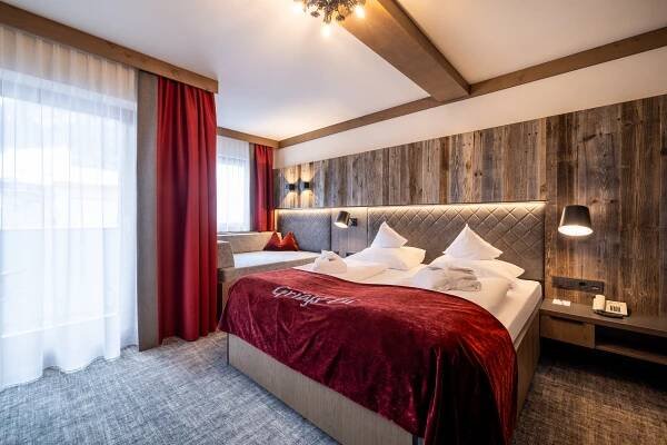Postel nebo postele na pokoji v ubytování Hotel Alpenrose
