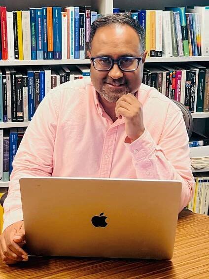 Image may contain Saurabh Patel Computer Electronics Laptop Pc Adult Person Head Face Accessories and Glasses