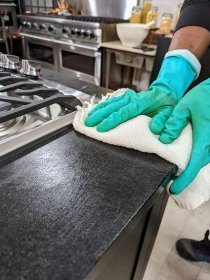 After everything is covered, Carlos goes over every surface again with a clean towel to remove any excess oil. Because soapstone is made primarily from talc, it has an extremely high resistance to chemicals and acids. It does not absorb water and soapstone retains heat and will not scorch when in contact with any cookware.