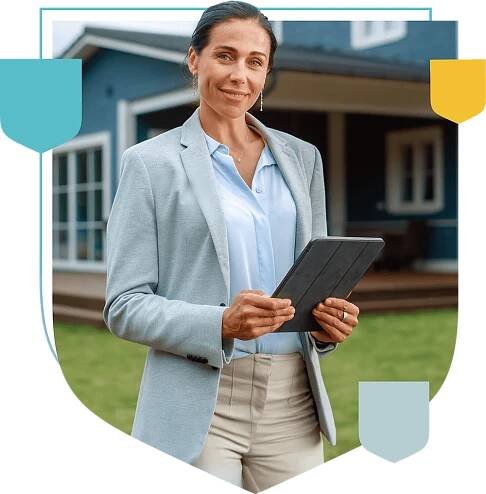 woman in front of a house holding a tablet