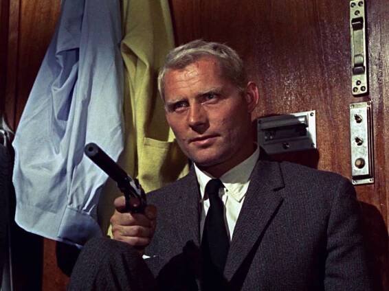 Iconic Actor Robert Shaw Brandishing a Gun Wallpaper