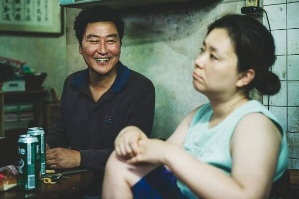 Song Kang-ho as Kim Ki-taek and Jang Hye-jin as Chung-sook in 'Parasite'