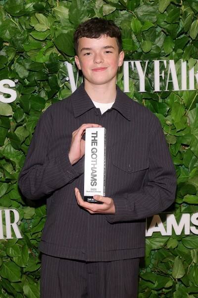 Owen Cooper holding a Gotham TV Award.