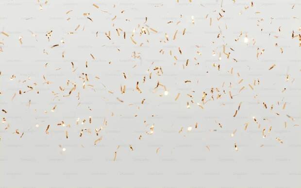 a lot of gold confetti on a white background