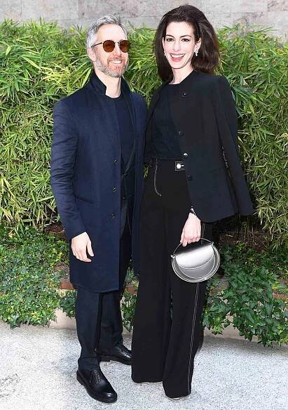 Adam Shulman and Anne Hathaway are seen on the front row of the Giorgio Armani fashion show during the Milan Fashion Week Fall/Winter 2022/2023 on February 27, 2022 in Milan, Italy.