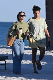 Later, they were spotted leaving the beach and Camila pulled on a pair of baggy jeans and a green long-sleeved, mock turtleneck top