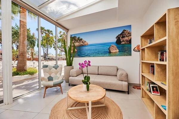 a living room with a couch and a table at Alua Boccaccio in Port d'Alcudia