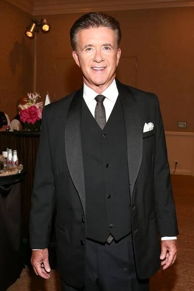 This image may contain Alan Thicke Tie Accessories Accessory Clothing Apparel Suit Coat Overcoat Tuxedo and Human