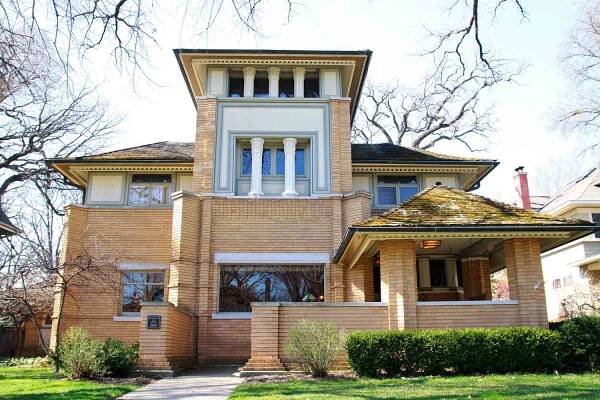 Front view of early Frank Lloyd Wright house with narrow three story center section