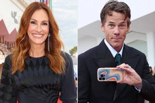Julia Roberts and Daniel Moder attend the "After The Hunt" red carpet during the 82nd Venice International Film Festival on August 29, 2025 in Venice, Italy. 