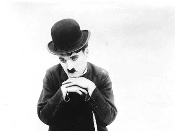 Charlie Chaplin, the Tramp, wears his trademark forlorn expression Wallpaper