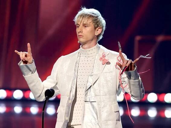 Machine Gun Kelly's Hot Pink and Black Stiletto Nails Are His Longest Manicure Yet — See Photos