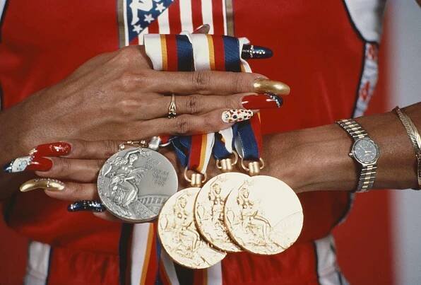 Florence Griffith-Joyner Holding Olympic Medals