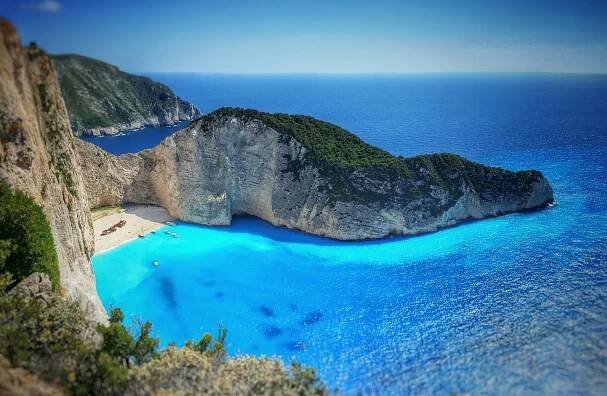 (Shqip) PLAZH NË ZAKYNTHOS – All Inclusive – Zante Royal Resort 4⭐ – 6 Ditë (5 Netë) ➡ Nisje 6, 13, 20, 27 Qershor / 4, 11, 18, 25 Korrik / 1, 8, 15, 22, 29 Gusht