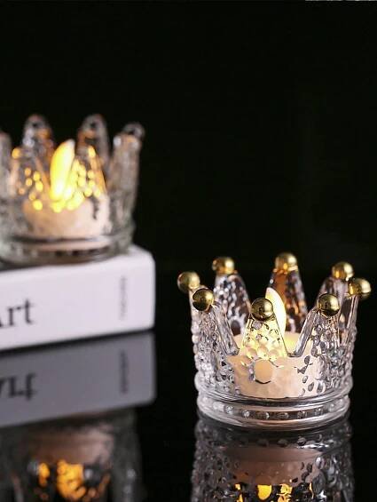 Add a touch of elegance to your home decor with the Regal Crystal Crown Candle Holder in Gold. Made of high-quality crystal, this candle holder exudes luxury and sophistication. The intricate crown design adds a regal touch, while the gold color complements any room. Perfect for adding a warm glow to your space and impressing your guests.