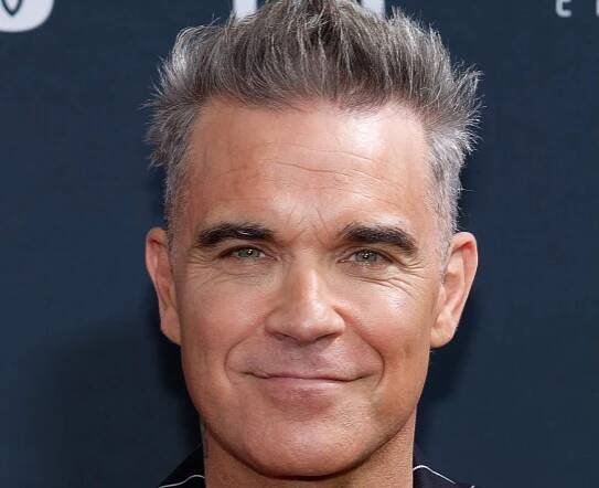 Robbie Williams odpálil "Rocket" s legendou Black Sabbath: Nový singl s Tonym Iommim je explozí rockové energie - i117.cz