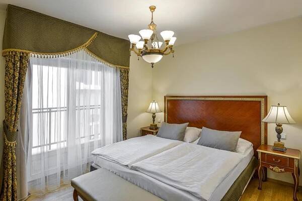 Postel nebo postele na pokoji v ubytování Residence Romanza