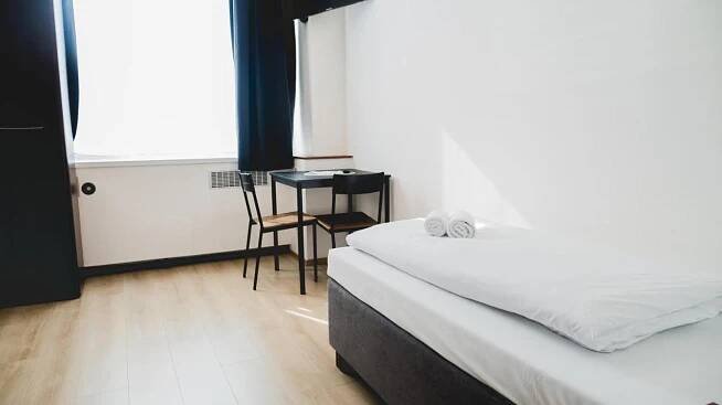 Postel nebo postele na pokoji v ubytování Hotel U Ševce
