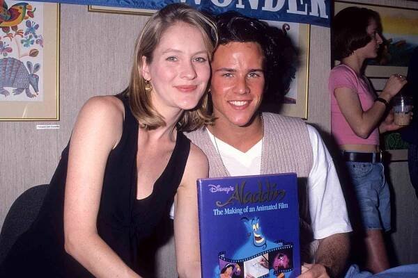 Actress Linda Larkin and actor Scott Weinger autograph copies of the classic children's book 