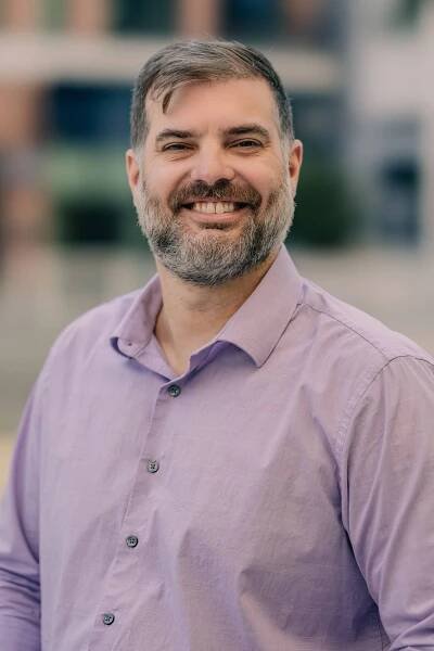 man in lavender button up shirt 