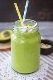 Matcha Protein Shake in a glass jar with straw