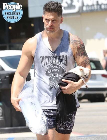 Joe Manganiello is seen for the first time since he and estranged wife Sofia Vergara announced they were divorcing - tightly clutching the couple's dog Bubbles