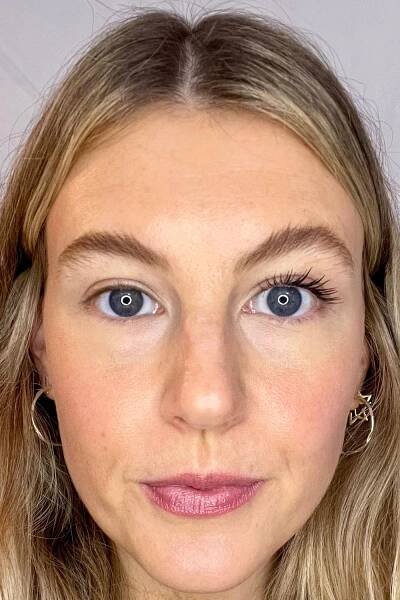beauty editor katie thomas shows herself wearing the Maybelline Lash Sensational Sky High Mascara on one eye, whilst the other is without
