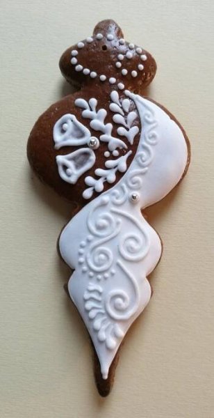 two decorated cookies sitting on top of each other