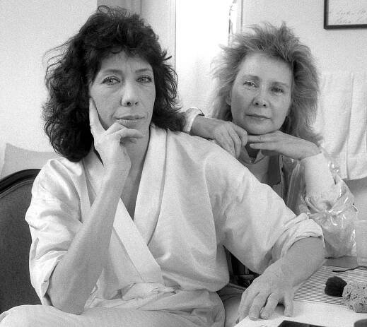 Lily Tomlin (left), an American actress, writer, comedian and Jane Wagner, American director and writer, pose in their dressing room at the Plymouth Theater, New York, NY, 1986