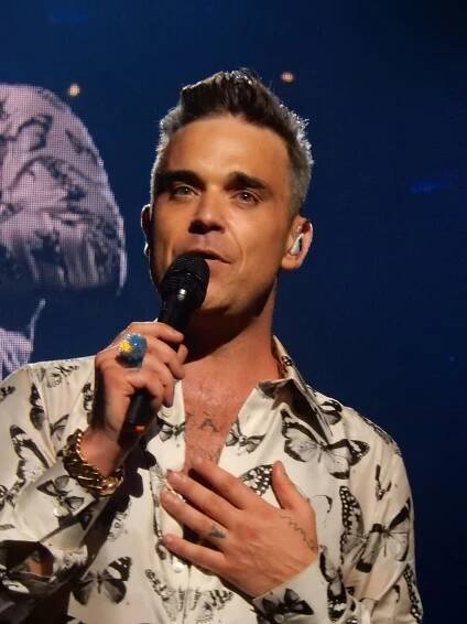 Robbie Williams jako digitální opice kritizuje v novém filmu showbyznys. Vzpomíná i na videoklip, kvůli...