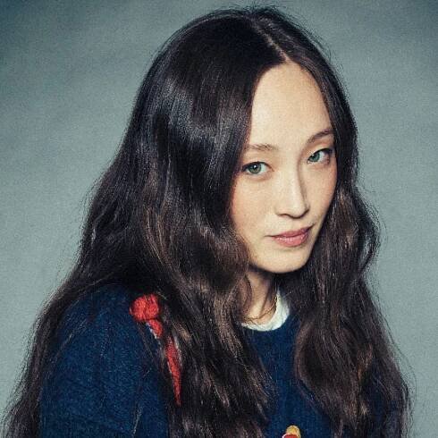 havana rose liu wears her hair in waves down long and a sweater in a headshot