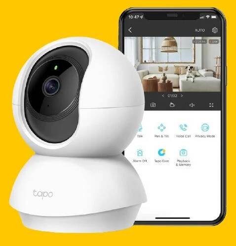 The Tapo C210 indoor camera and smartphone with app against an orange background.