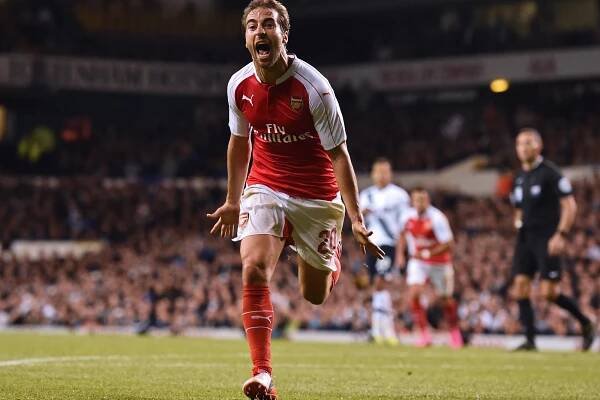 Arsenal's Mathieu Flamini celebrates after scoring a goal against Tottenham Hotspur in a League Cup match on September 23.